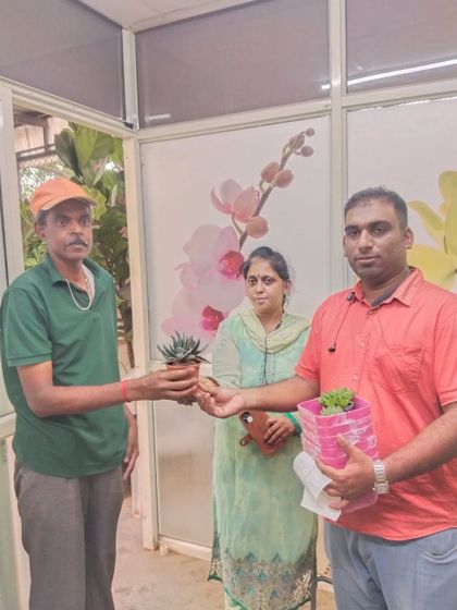 Our team member handing a free succulent to a family on World Environment Day. It's a joy to introduce people to the world of planting.