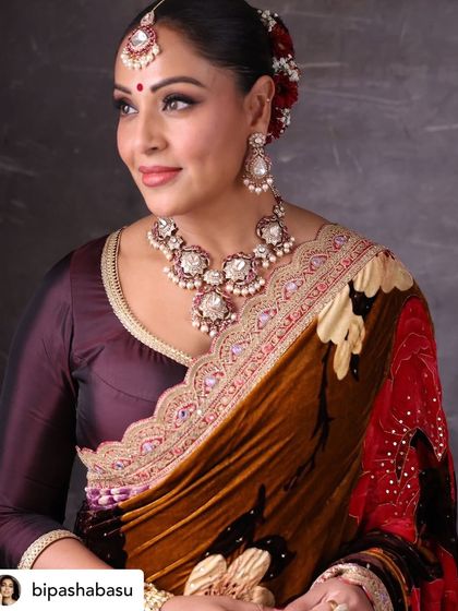 A solo portrait of Bipasha Basu showcasing her stunning traditional attire and jewelry. We pay close attention to the details that make these events special.