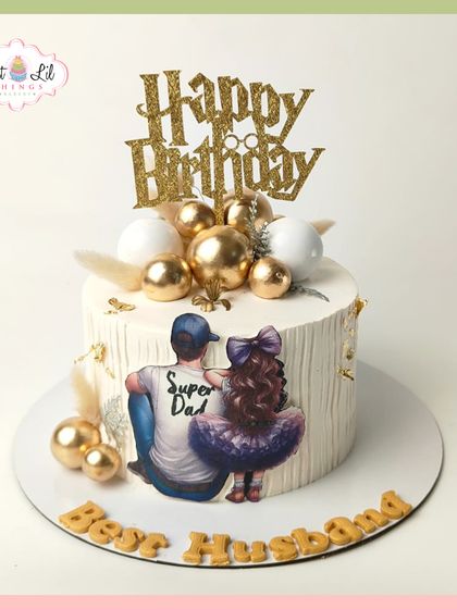 A heartwarming cake for the "Super Dad" and "Best Husband." This design features a touching illustration of a father and daughter, surrounded by gold and white spheres.