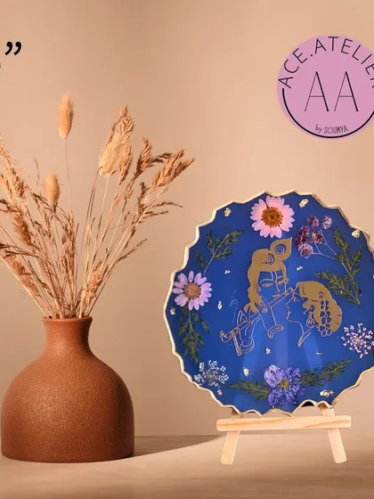 This 6-inch Radha Krishna frame features a deep blue background with their golden image surrounded by real flowers.