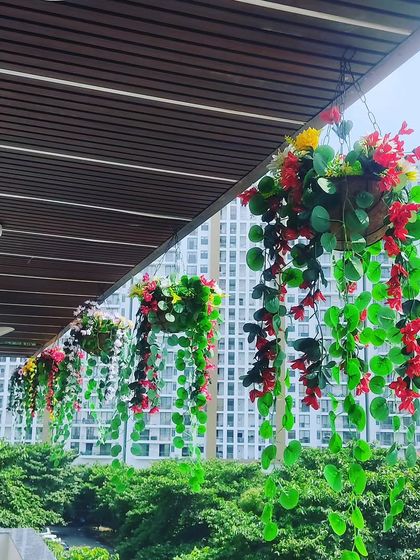 Simple and colorful hanging baskets for a balcony. I used artificial vines and flowers that cascade down, adding color and life without taking up any floor space.