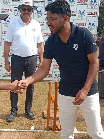 Prashant Tayde of Dream Sports shaking hands with a young captain at the tournament inauguration.