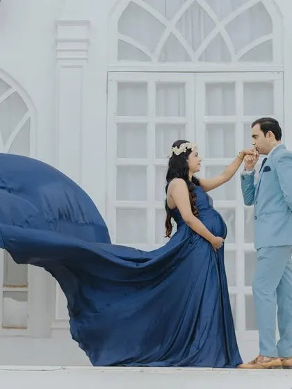 A beautiful pose with the gown's train flowing, creating a sense of motion and artistry in this romantic couple's portrait.