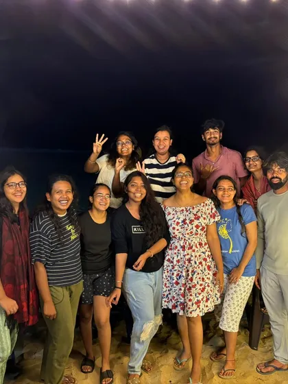 A nighttime group photo, showing the fun continues even after the sun goes down.