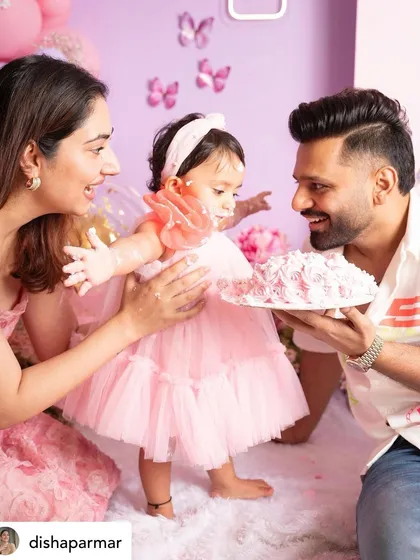 This image, shared by the celebrity parents, shows the fun and messy reality of a cake smash. It's all about capturing the real, joyful moments.