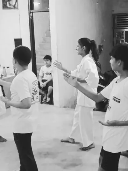 Another shot of the students during kihon practice. Each student is focused on their own technique while moving in sync with the group.