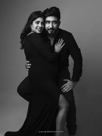 A glamorous and powerful couple's maternity portrait. Black and white gives it a classic, old-Hollywood feel, full of style and connection.