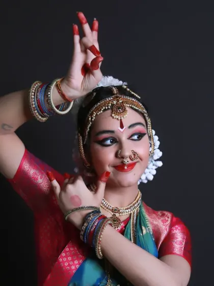 The power and grace of a Bharatnatyam dancer captured mid-pose. For this pre-Arangetram photoshoot, I focused on the intricate hand mudras and expressive glances that define this classical dance form. It's an honor to document such profound cultural artistry.