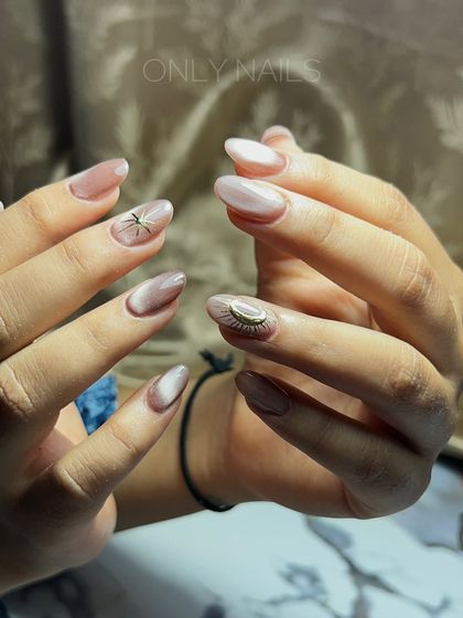 A different perspective of the neutral cat eye set, showcasing the intricate 3D evil eye charm and the subtle shimmer of the magnetic polish.