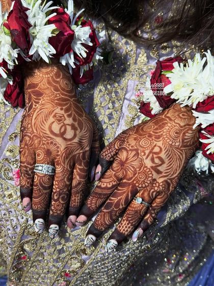 This bride wanted her and her partner's initials, 'R' and 'Z', to be a prominent part of her henna design.