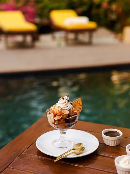 A decadent dessert sundae served by the pool, because slow living should always include a touch of sweetness.
