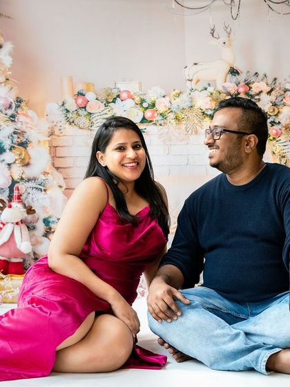 A beautiful couple enjoying the festive atmosphere. My Christmas sessions aren't just for kids; they're for anyone who loves the holiday season.