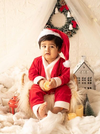 Getting into the festive spirit with a Christmas-themed mini-session. This little Santa is sitting in a snowy, magical wonderland.