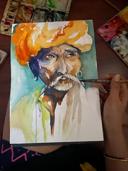 A quick watercolor sketch of a man in a vibrant orange turban. Capturing the essence of a person's character with just a few brushstrokes is a practice I truly enjoy.