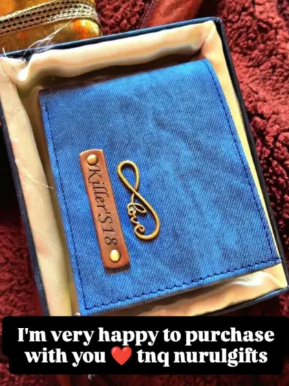 "I'm very happy to purchase with you." A happy customer shares a photo of their blue denim wallet with a 'love' charm.