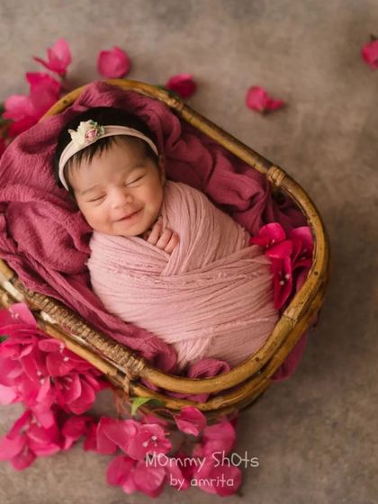 A beautiful example of using fresh flowers to complement a simple basket prop, adding a pop of color and natural texture.
