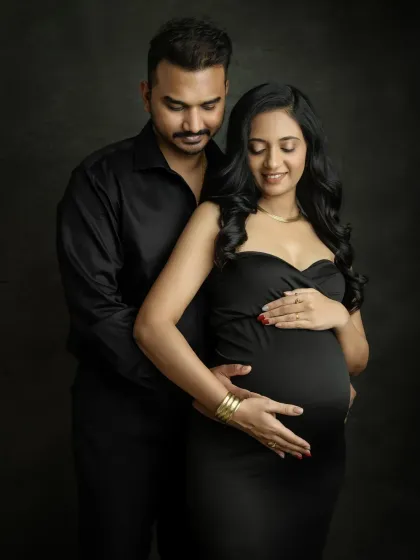A beautiful pose that focuses on the love and anticipation you both share. The way you both cradle the baby bump makes this a heartwarming and intimate portrait.