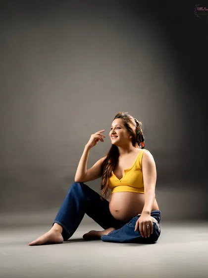 A relaxed and happy portrait in a casual outfit. This shows that you don't always need a gown to create a beautiful maternity photo.