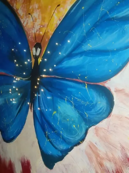 Another butterfly mural, this time with a more abstract and vibrant feel. I used a bold blue for the butterfly and added tiny fairy lights to its body to make it sparkle and come alive at night.