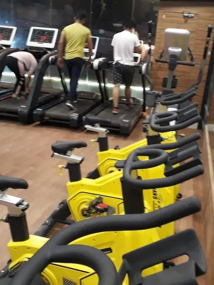 Another look at our cardio floor, showing members using the treadmills. We provide a clean, air-conditioned space for you to comfortably complete your daily running or walking goals.