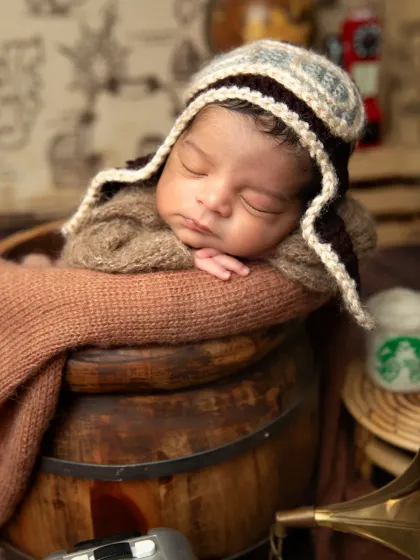 This setup includes vintage props like a gramophone and a miniature suitcase to enhance the old-world traveler theme.