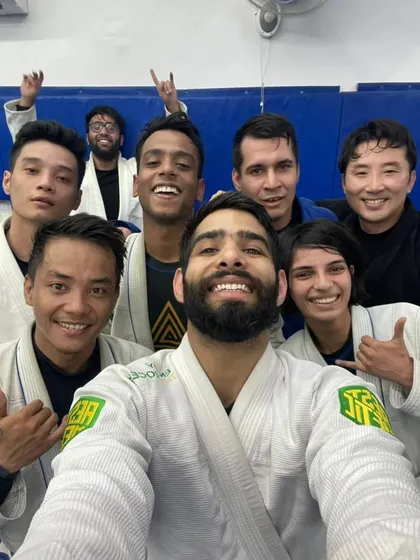 An energetic selfie after a dynamic Gi sparring session.