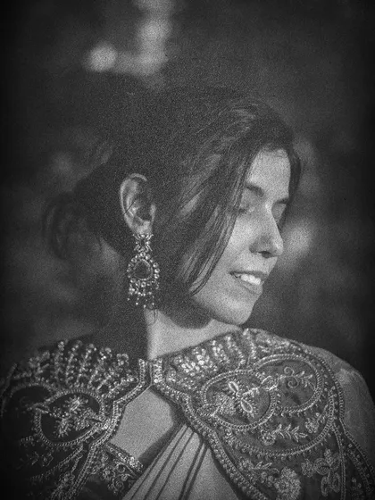 A soft, dreamy close-up from our retro-inspired shoot. The grainy texture and soft focus add to the nostalgic and romantic vibe of the portrait.