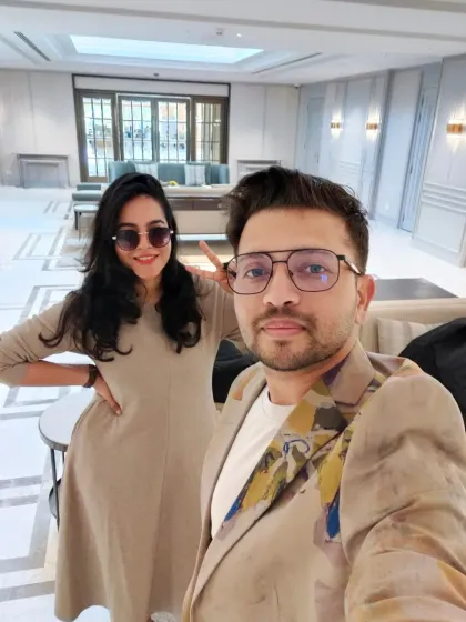 A selfie of us, Varsha and Vivek, at the venue for Keerthy Suresh's wedding. We were so excited for this dream project.