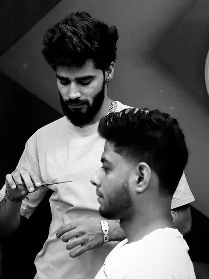 Life is a collection of beautiful moments. This photo captures the artistry and concentration that goes into every haircut.
