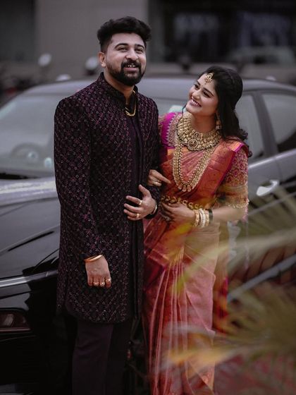 A classic portrait of the couple by a car. Her admiring glance at him creates a sweet and story-driven image.