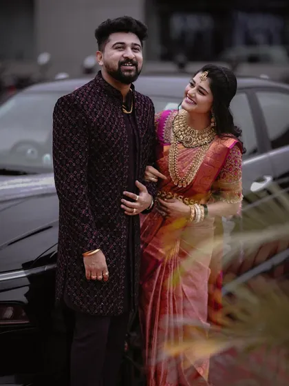 A classic portrait of the couple by a car. Her admiring glance at him creates a sweet and story-driven image.
