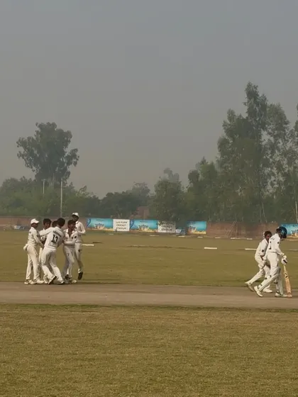 The team celebrating the last wicket of the innings.