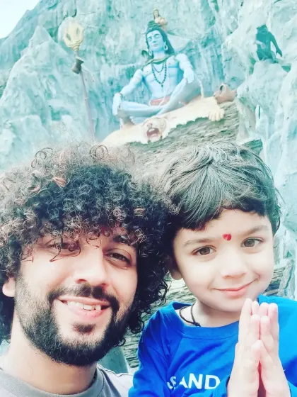 Sharing a blessed moment with my son in front of a beautiful Shiva murti. Passing on our traditions and faith to the next generation is so important to me, and I bring this sense of family and devotion to every event.
