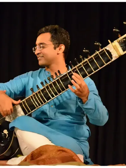 A candid moment of musical expression on the IIC stage.