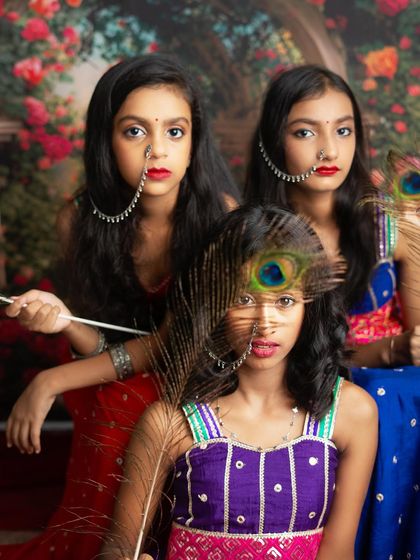 A creative and artistic shot from our Radha Rani session, using a peacock feather to frame the face. I love adding these unique touches.