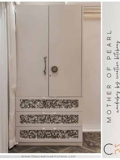 A full view of the "Mother of Pearl" wardrobe, showcasing its unique combination of textures and finishes. It's a perfect example of how we blend functionality with artistry.