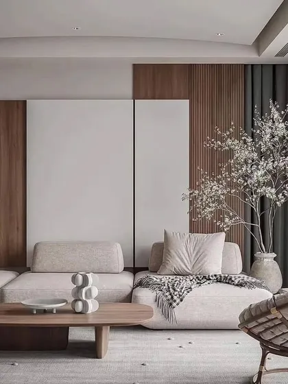 A close-up view of the seating area, highlighting the mix of textures from the sofa fabric, woven pouf, and wooden coffee table. These details are essential in creating a layered and inviting interior space.