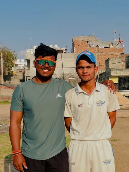 Here I am with Kamlesh Rajput after he scored a brilliant century. 110 not out is a great achievement.