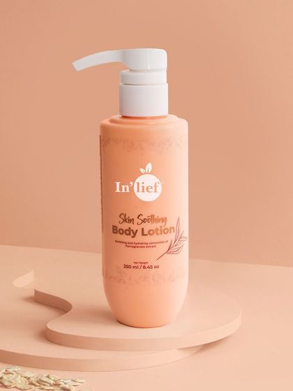 A clean studio shot of the In'lief body lotion on a raised platform. This simple, elegant presentation focuses all attention on the product's packaging and branding.