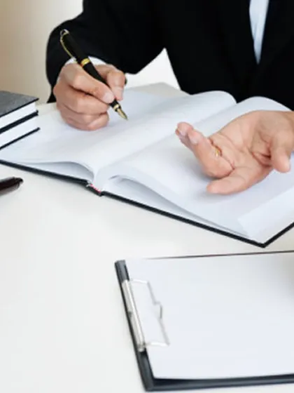 A handshake over a desk with a gavel nearby symbolizes the professional relationship we build with our clients. We are here to provide trusted legal counsel and representation, ensuring your matters are handled with expertise.