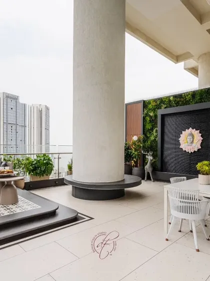 An overall view of the beautifully lit terrace at dusk, creating a magical and inviting atmosphere. It’s an urban oasis designed for making memories.
