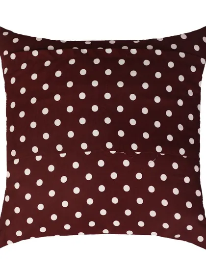 The back of a maroon polka dot cushion cover, showing the envelope closure.