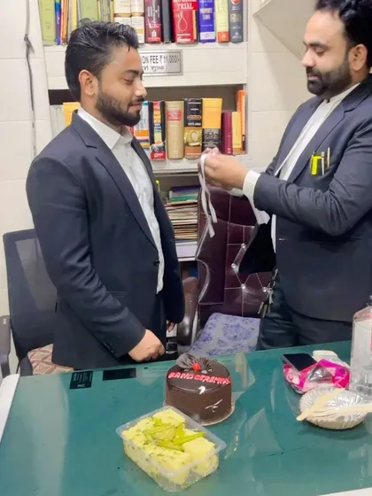My mentor preparing the advocate's band for me. A significant and memorable moment in my professional life.