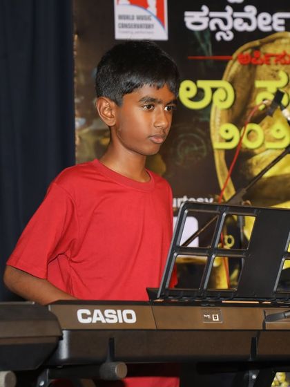 A young keyboardist performing a patriotic song for Independence Day.