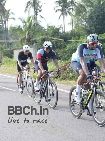 A group of masters riders from Equipe Goa and other teams work together on the road.