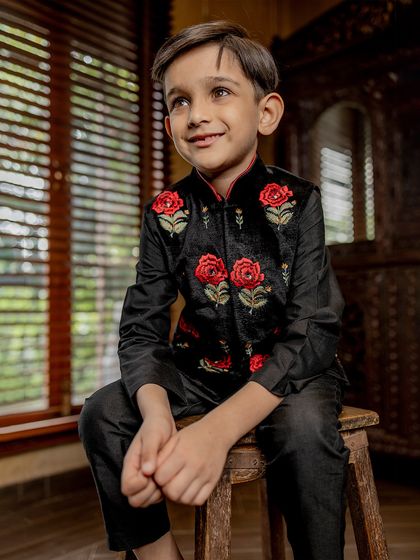A happy and relaxed portrait in our red rose Bundi set. The smile on his face shows that our outfits are made for enjoying the moment.