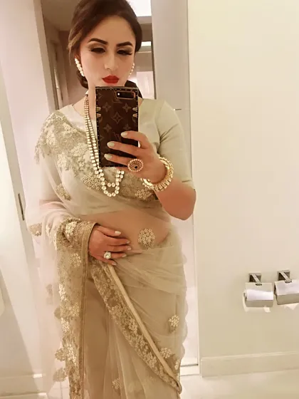 A classic beige and gold net saree is the epitome of grace. I styled this one with a string of pearls and a statement ring for a look that's perfect for a formal family function or elegant evening affair.
