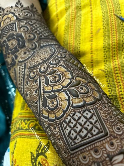 A detailed shot of the forearm, showcasing the fine line work and shading.