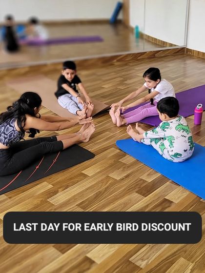 A group of my youngest students learning Paschimottanasana, or seated forward fold, with me. We make stretching fun and accessible for every little body.
