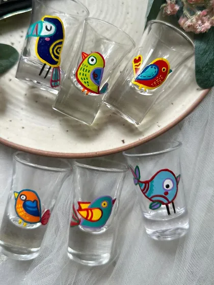 Introducing our new shot glasses. This set features a variety of cute, quirky, hand-painted birds.
